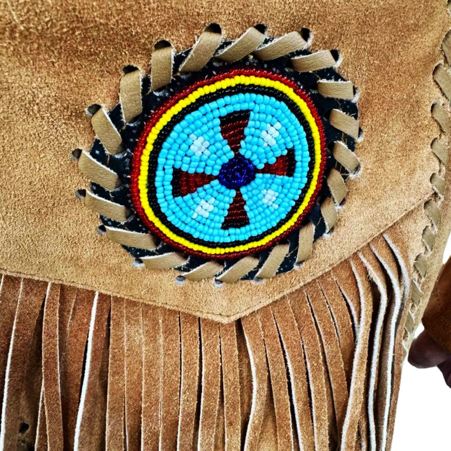 The suede leather fringe jacket with eagle beadwork, pictured worn and styled