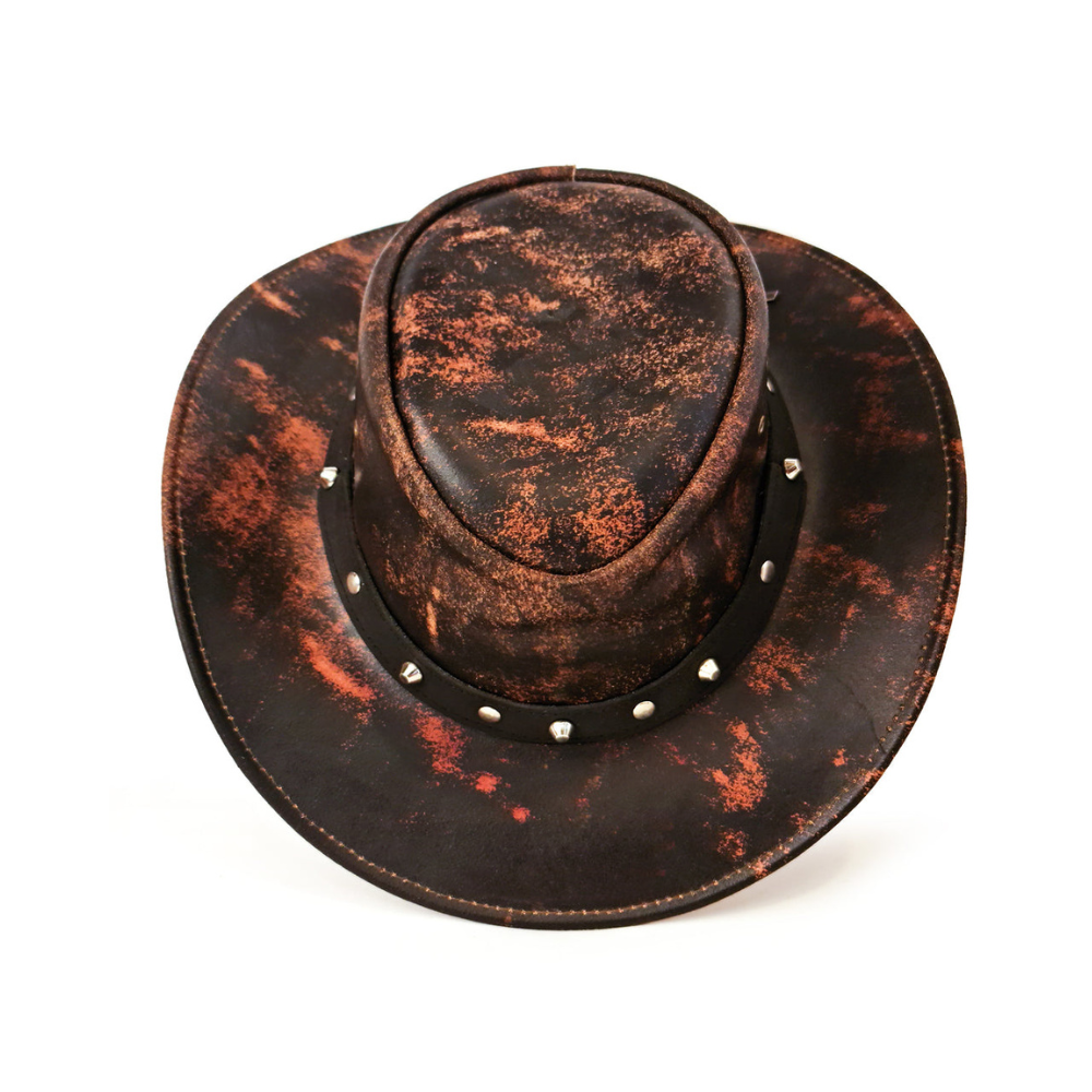 Distressed brown leather cowboy hat with studded band on a white background