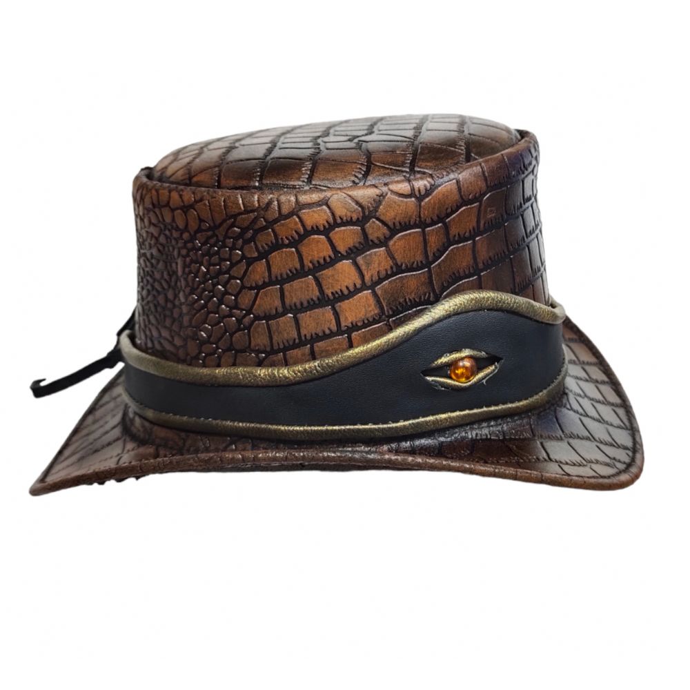 Brown leather hat with decorative band and stone on a white background
