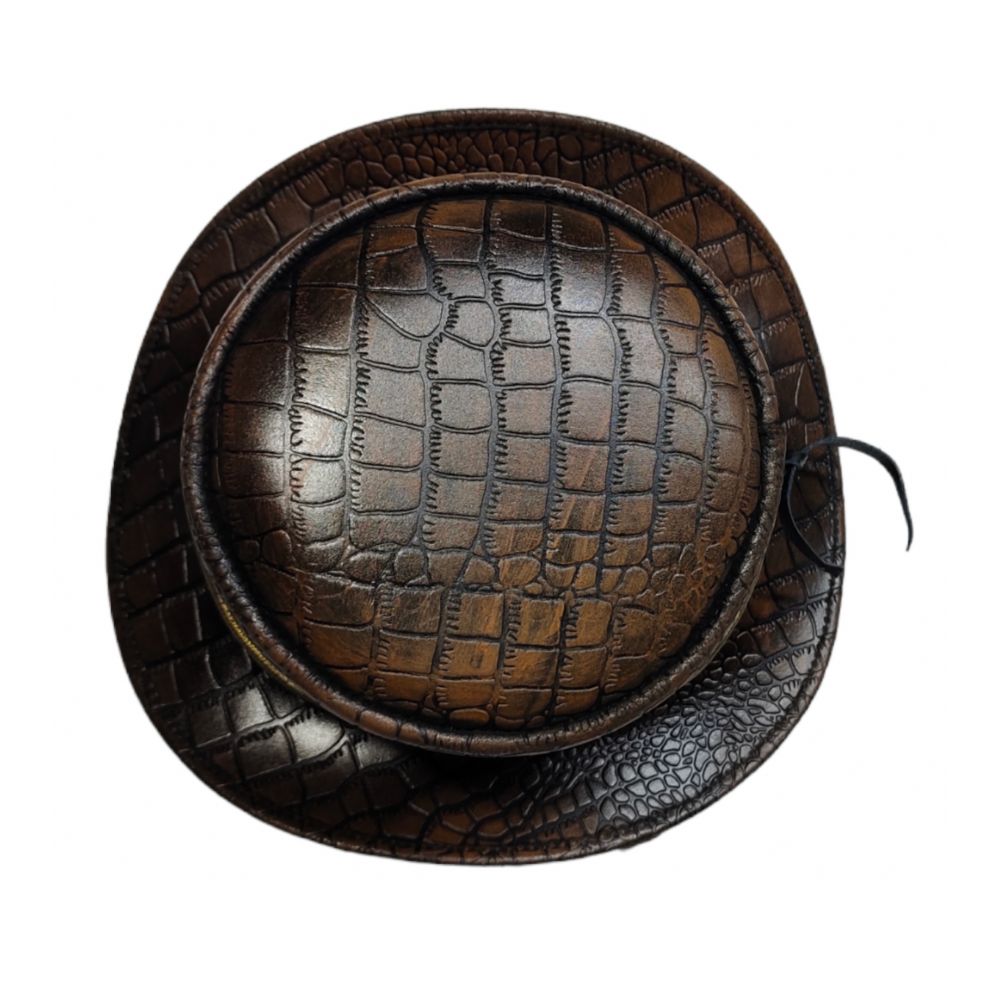 Brown leather hat with crocodile texture on a white background